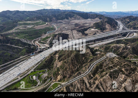 Aerial view of the Golden State 5 Freeway, Los Angeles Aqueduct and Sunshine Canyon Landfill near Santa Clarita, California. Stock Photo