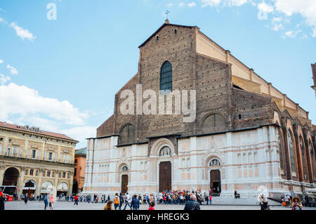 Tourists visiting the Basilica di San Petronio which is located at the Piazza Maggiore in Bologna, Italy. Stock Photo