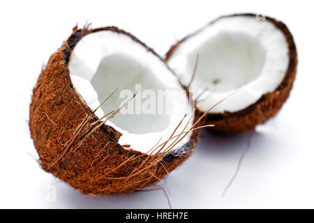 Coconut cut in two pieces on a white background Stock Photo