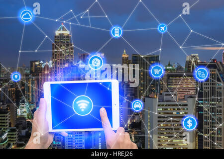 Network of connect digital tablet with wireless communication network, business district with office building, abstract image visual, internet of thin Stock Photo