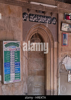 Prayer times, known as Salah, listed in the sixteenth century Siddi Sayed mosque in the old city of Ahmedabad in Gujarat state, India Stock Photo