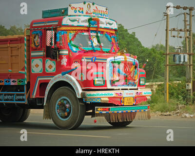 The brightly painted cab of a truck on the Gujarat state highway, India. Many Indian trucks are elaborately decorated by their drivers Stock Photo