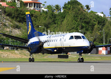 A Seaborne Airlines Saab SF.340 prepares to depart St. Maarten back to its operating base in San Juan, Puerto Rico. Stock Photo
