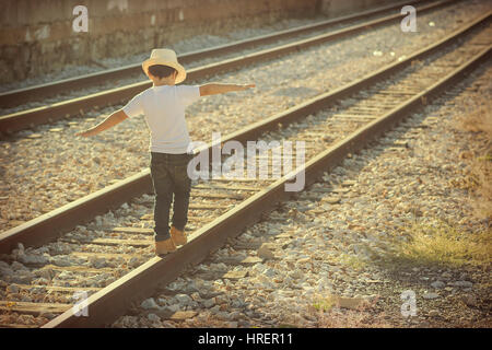 Child on the train tracks Stock Photo
