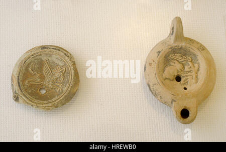Roman Era. High empire. Terracotta oil lamp. Central disk decorated with reliefs. Spain.n. National Archaeological Museum. Tarragona. Catalonia, Spain. Stock Photo