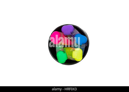 several colored highlighters in a round metal box. Top view Stock Photo