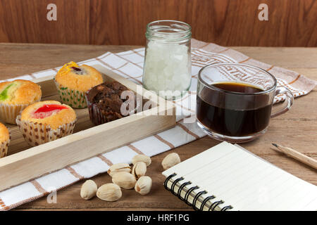 Cupcake various flavors in wood tray on wood table. coffee break with the idea Stock Photo