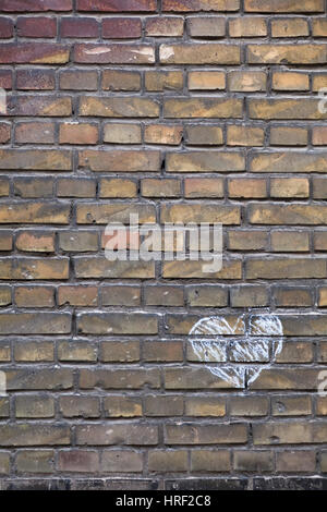Hand Drawn Chalk Heart on an Brick Wall as a Background Stock Photo