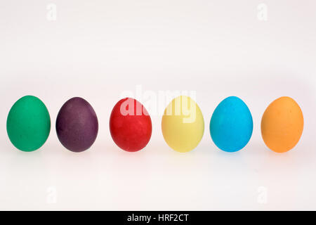 Six Easter eggs in a line on a white background Stock Photo