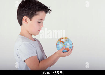 child holding earth in hands Stock Photo