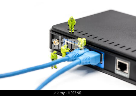 Network engineers connecting cables to the network switch. Macro photo Stock Photo