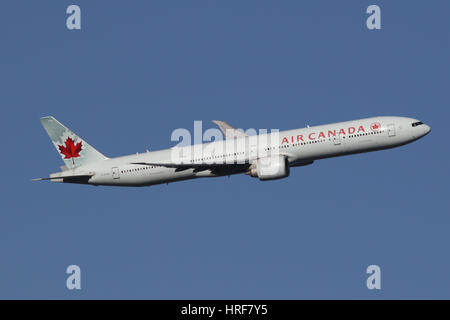 Air Canada plane Boeing 777 (777-300ER) taking off behind a Vancouver ...