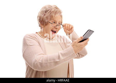 Excited senior looking at a phone isolated on white background Stock Photo