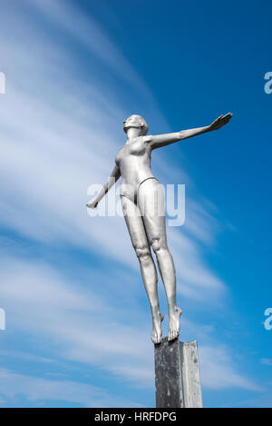 Diving Belle statue beside the lighthouse at Scarborough harbour, North Yorkshire, England. Stock Photo