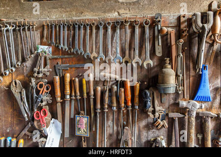 Tool board with old tools in a workshop Stock Photo