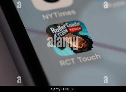 The popular RollerCoaster Tycoon game is seen in the iTunes App Store on 1 March, 2017. Recenlty the newer version, the Touch version went on sale in  Stock Photo