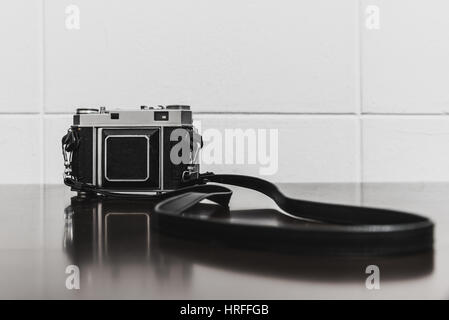 Vintage camera on wooden table Stock Photo