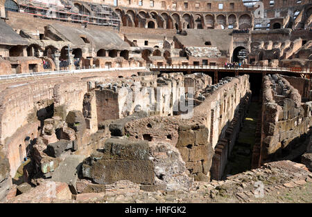 ROME, ITALY - MARCH 15, 2016: Tourists visiting the interior of the Colosseum, one of the New Seven Wonders of the World Stock Photo