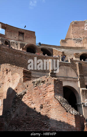 ROME, ITALY - MARCH 15, 2016: Tourists visiting the interior of the Colosseum, one of the New Seven Wonders of the World Stock Photo