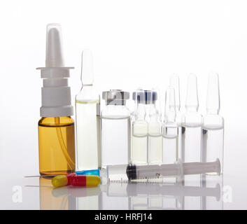 medical ampules, pills and syringes, isolated on white Stock Photo