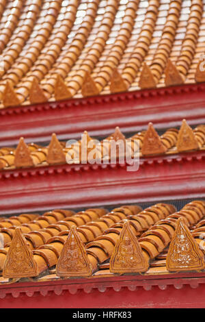 Closeup of beautiful red roof tiles on the famous marble temple (Wat Benchamabophit) in Bangkok Stock Photo