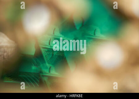 Abstract kaleidoscopic reflections of a temple in glass tiles - Wat Arun, Bangkok, Thailand Stock Photo