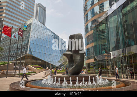 Exchange Square with fountain, Henry Moor 'Oval with Points' sculpture and Exchange Square podium building in downtown Hong Kong, China Stock Photo