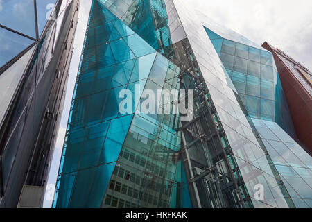 Modern architecture in Tokyo, the amazing Audi Forum building, with asymmetric reflecting glass facade, also called Iceberg, in Shibuya, Tokyo, Japan