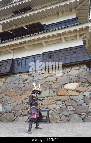 Samurai actor in front of medieval Matsumoto Castle in Matsumoto city, Japanese Alps, Japan Stock Photo