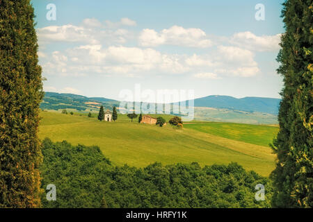 Tuscany, italian rural landscape, cypress trees Vitaleta chapel on background, little church, Italy Stock Photo