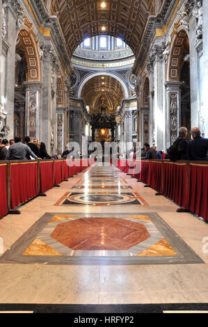 VATICAN, ITALY - MARCH 16, 2016: The famous Saint Peter basilica is the biggest church in the World and is visited daily by thousands of tourists and  Stock Photo