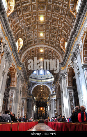 VATICAN, ITALY - MARCH 16, 2016: The famous Saint Peter basilica is the biggest church in the World and is visited daily by thousands of tourists and  Stock Photo