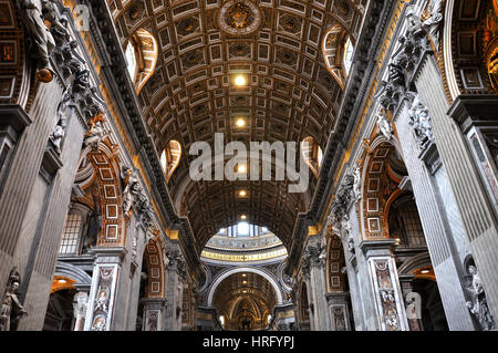 VATICAN, ITALY - MARCH 16, 2016: The famous Saint Peter basilica is the biggest church in the World and is visited daily by thousands of tourists and  Stock Photo