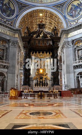 VATICAN, ITALY - MARCH 16, 2016: The famous wooden baldachin, altar of Saint Peter basilica was made by Bernini and is visited daily by thousands of t Stock Photo