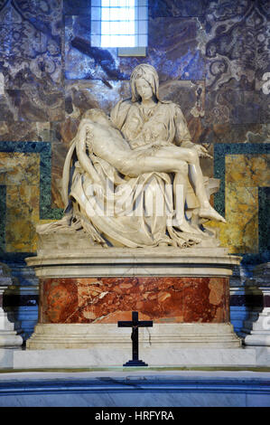 VATICAN, ITALY - MARCH 16, 2016: The famous sculpture of Pieta in the Saint Peter basilica was made by Michelangelo and is visited daily by thousands  Stock Photo