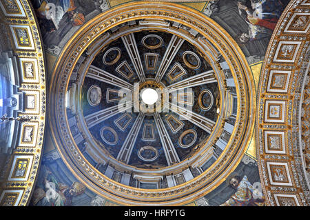 VATICAN, ITALY - MARCH 16, 2016: The ceiling of the Saint Peter basilica was painted over decades and is visited daily by thousands of tourists and re Stock Photo