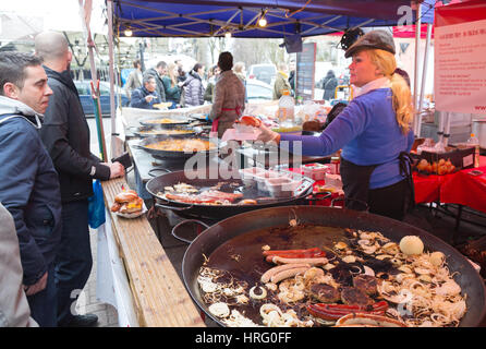 London market; Street food London UK - People buying food at a stall, the Acklam Food Market, Portobello Road, Notting Hill, London England UK Stock Photo