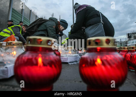 Gdansk, Poland. 1st March 2017. People lighting candles to celebrate the National Day of Cursed Soldiers are seen on 1 March 2017  in Gdansk, Poland. After Poland's official underground army (AK) of World War II disbanded in 1945, thousands of Poles continued to fight in other formations against the imposition of communism as the Soviet Red Army extended its grip across the country. They have since become known as the 'Cursed Soldiers' Credit: Michal Fludra/Alamy Live News Stock Photo