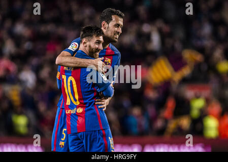 Barcelona, Catalonia, Spain. 1st Mar, 2017. FC Barcelona forward MESSI celebrates scoring the opening goal for Barcelona with FC Barcelona midfielder SERGIO in the LaLiga match against Sporting at the Camp Nou stadium in Barcelona Credit: Matthias Oesterle/ZUMA Wire/Alamy Live News Stock Photo