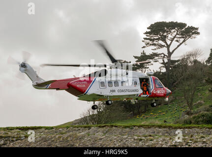 St Michaels Mount, Cornwall, UK. 1st March 2017. Newquay based coastguard Helicopter on approach to land at St Michaels Mount, Cornwall,UK Credit: Bob Sharples/Alamy Live News Stock Photo