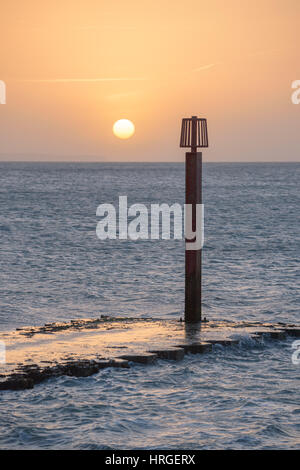 Weymouth Bay, Dorset, UK. 2nd March, 2017. Sun rises on a clear and crisp spring morning over Weymouth Bay, the first fine day of spring. © Dan Tucker/Alamy Live News Stock Photo