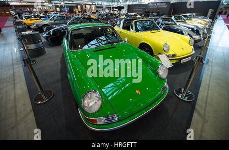 Stuttgart, Germany. 02nd Mar, 2017. Various incarnations of the Porsche 911 at a classic cars trade show in Stuttgart, Germany, 02 March 2017. Around 1550 exhibitors are displaying their most beautiful classic cars between the 02.03.17 and the 05.03.17. Photo: Lino Mirgeler/dpa/Alamy Live News Stock Photo