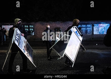 Denmark, Copenhagen, March 1st. 2017. Left wing activists took the streets of Copenhagen ten years after the demolition of the Ungdomshuset youth house at Jagtvej 69. Under the statement “The fight continues, nothing forgotten, nothing forgiven” the activists clashed with the police during the march. Here the activists attack the police with signs from the supermarket ALDI. Credit: Gonzales Photo/Alamy Live News Stock Photo