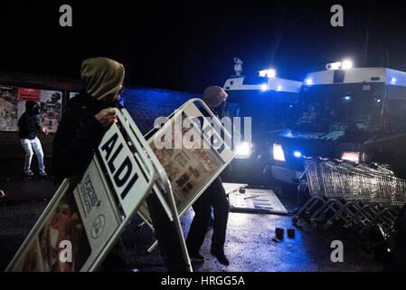 Denmark, Copenhagen, March 1st. 2017. Left wing activists took the streets of Copenhagen ten years after the demolition of the Ungdomshuset youth house at Jagtvej 69. Under the statement “The fight continues, nothing forgotten, nothing forgiven” the activists clashed with the police during the march. Here the activists attack the police with signs from the supermarket ALDI. Credit: Gonzales Photo/Alamy Live News Stock Photo