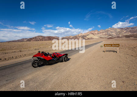 Slingshot 3-wheeled motorcycle, people, tourists, visitors, Artist Drive, Black Mountains, Death Valley National Park, Death Valley, California, Unite Stock Photo