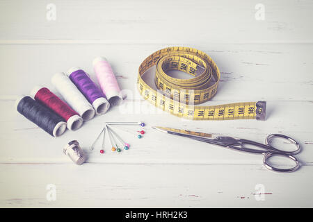 Sewing accessories on wood table Stock Photo