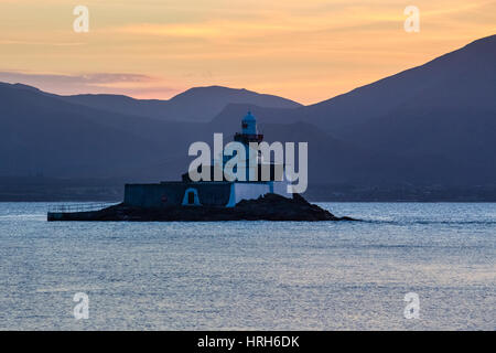 Fenit Lighthouse at sunset looking across tralee bay towards the Dingle Peninsula, County Kerry, Ireland Stock Photo