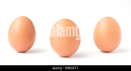 Three upright chicken eggs isolated on a white background Stock Photo