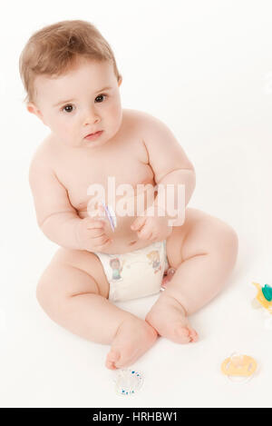 Model released, Baby in Windeln mit Schnullern - baby with dummies Stock Photo
