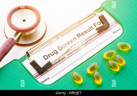 medications pills drug test report with stethoscope on white background. Stock Photo